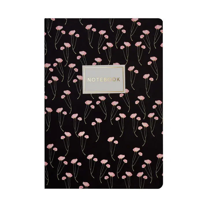 Notebook with pink floral pattern on a black background