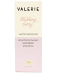 half white half pale pink packaging for chocolate bar. text on bar is black