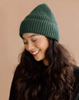 girl wearing a green knit beanie