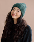 girl wearing a green knit beanie