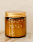 mini amber candle jar with 'GINGERBREAD' printed on it