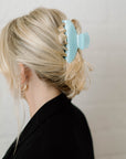 blue hair clip in blonde hair