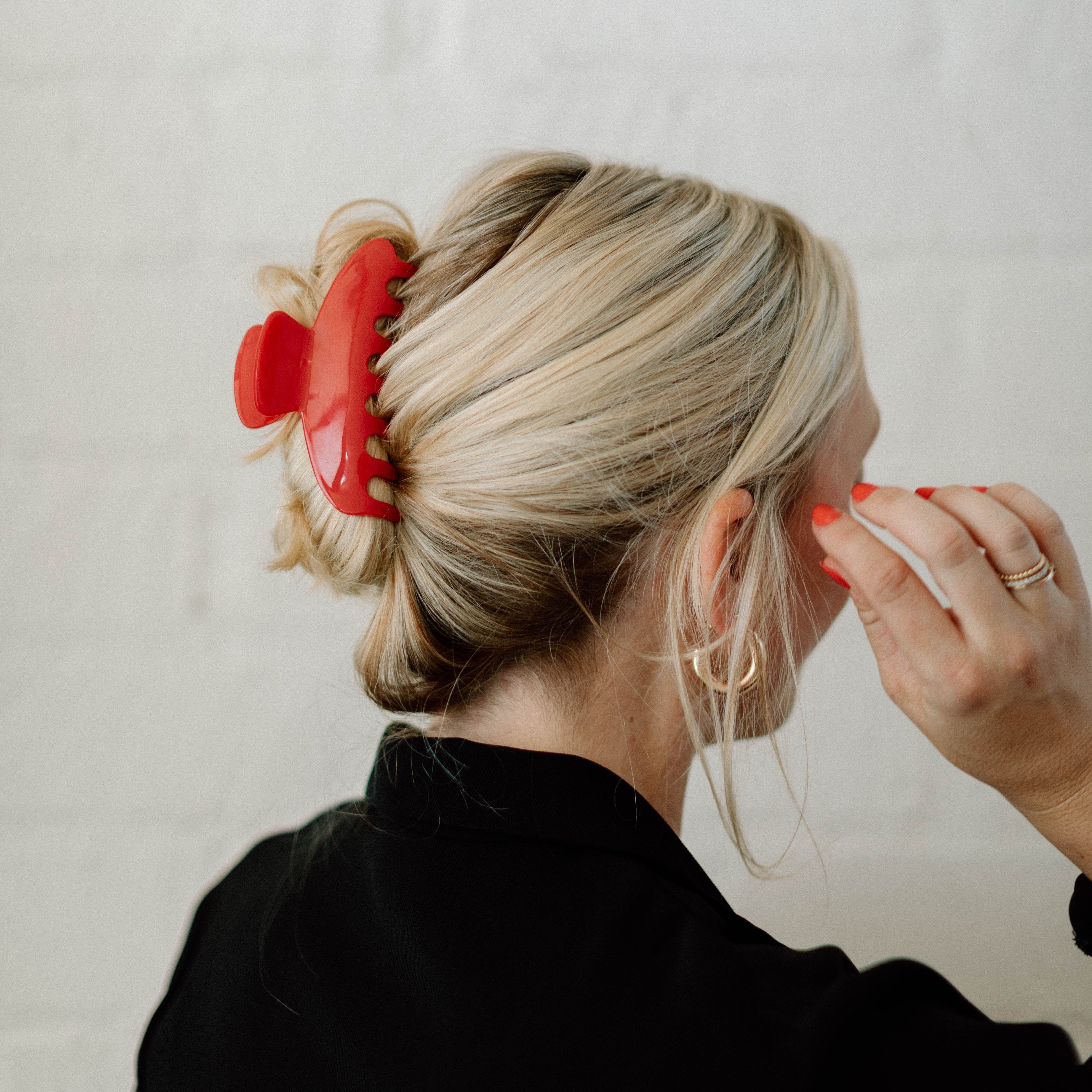 red hair clip in blonde hair