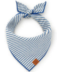 blue and white stripped dog bandana. Has blue hem and brown leather tag on the edge