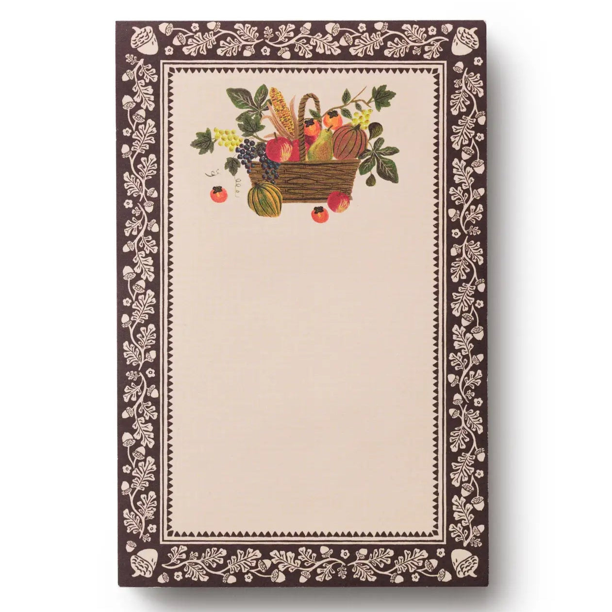 Notebook with decorative cover featuring a basket of fruits and vegetables on a white background