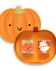 A pumpkin-shaped orange gift box set from sugarfina, featuring a large pumpkin lid with a smiling face and a smaller pumpkin-shaped base holding two small decorative candy or accessory boxes with cartoon pumpkin and ghost designs.