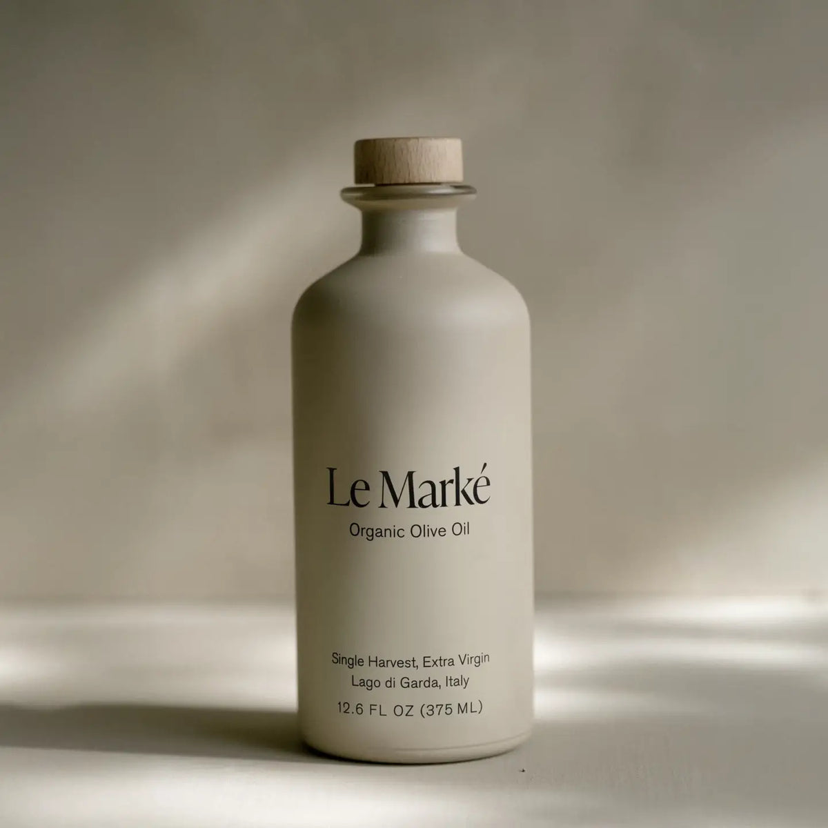 Le Marké Organic Olive Oil bottle on a neutral background