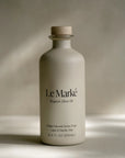 Le Marké Organic Olive Oil bottle on a neutral background