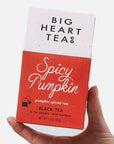 red tea carton with 'spicy pumpkin' written on it in white