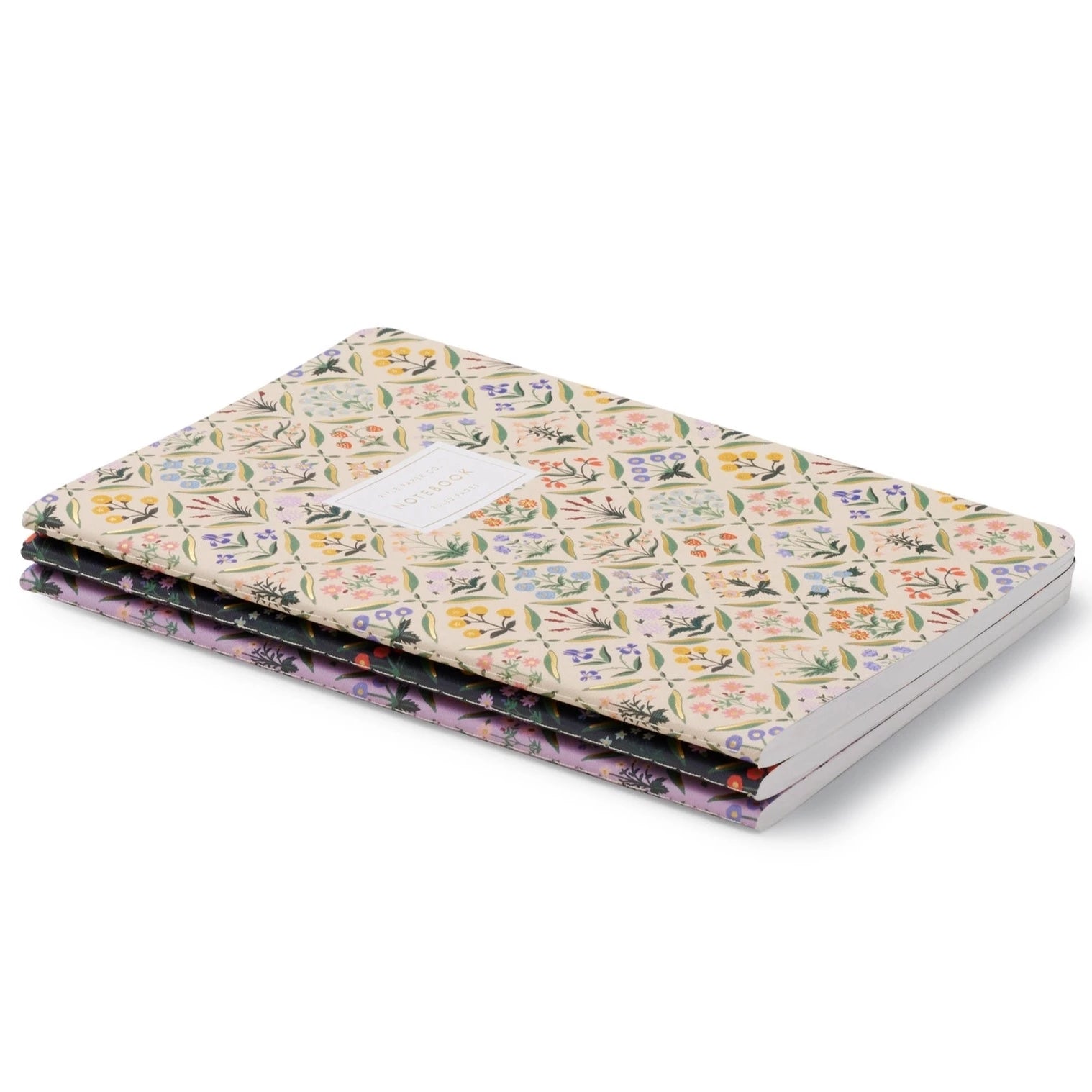 stack of notebooks in a variety of colors