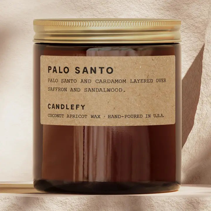 Candle with a label on a neutral background