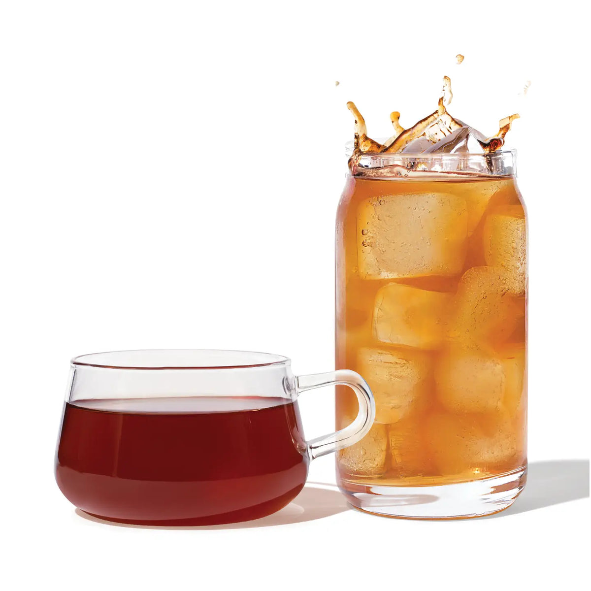 Glass mug and jar with iced tea on a white background