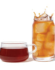 Glass mug and jar with iced tea on a white background