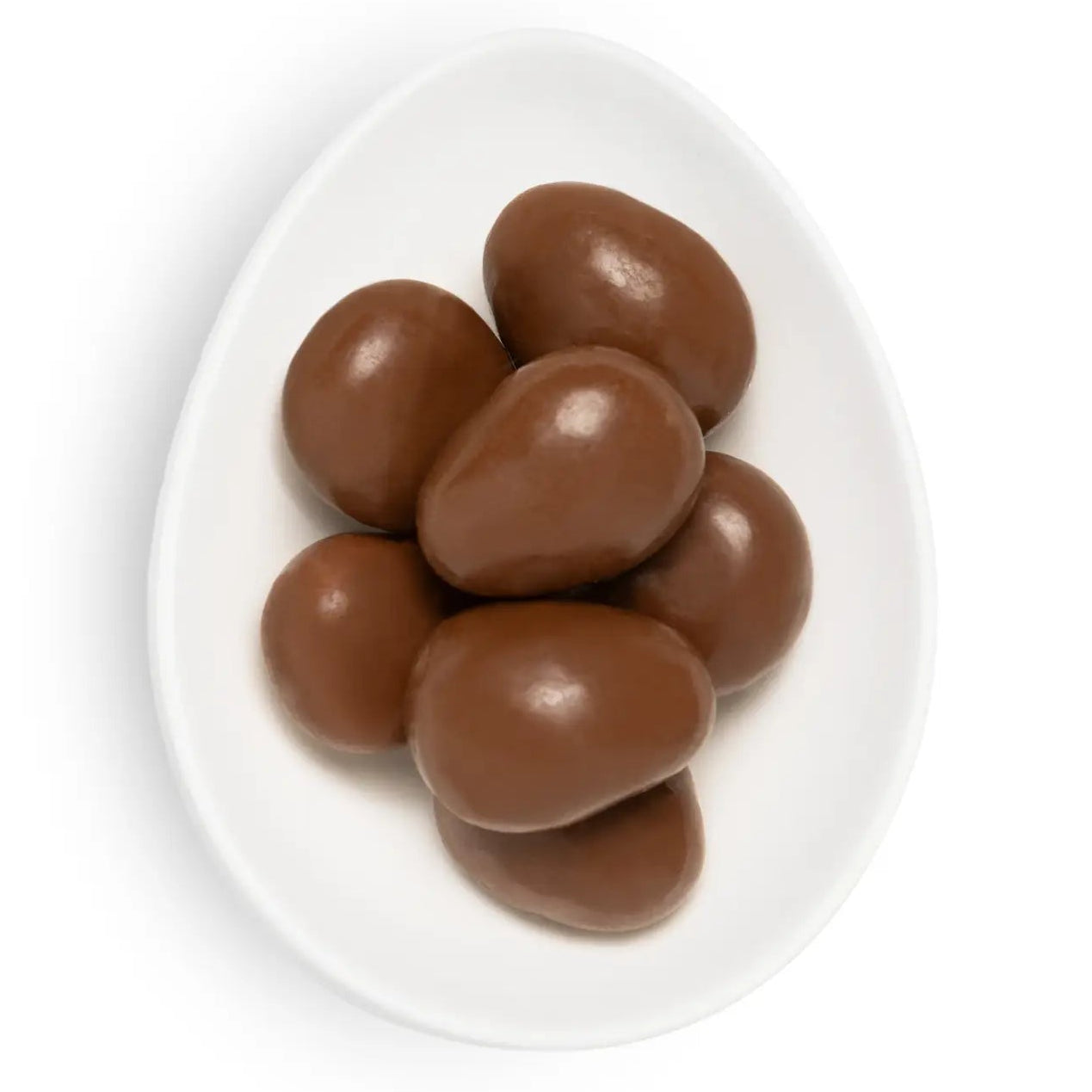 Chocolate-covered almonds on a white plate with a white background