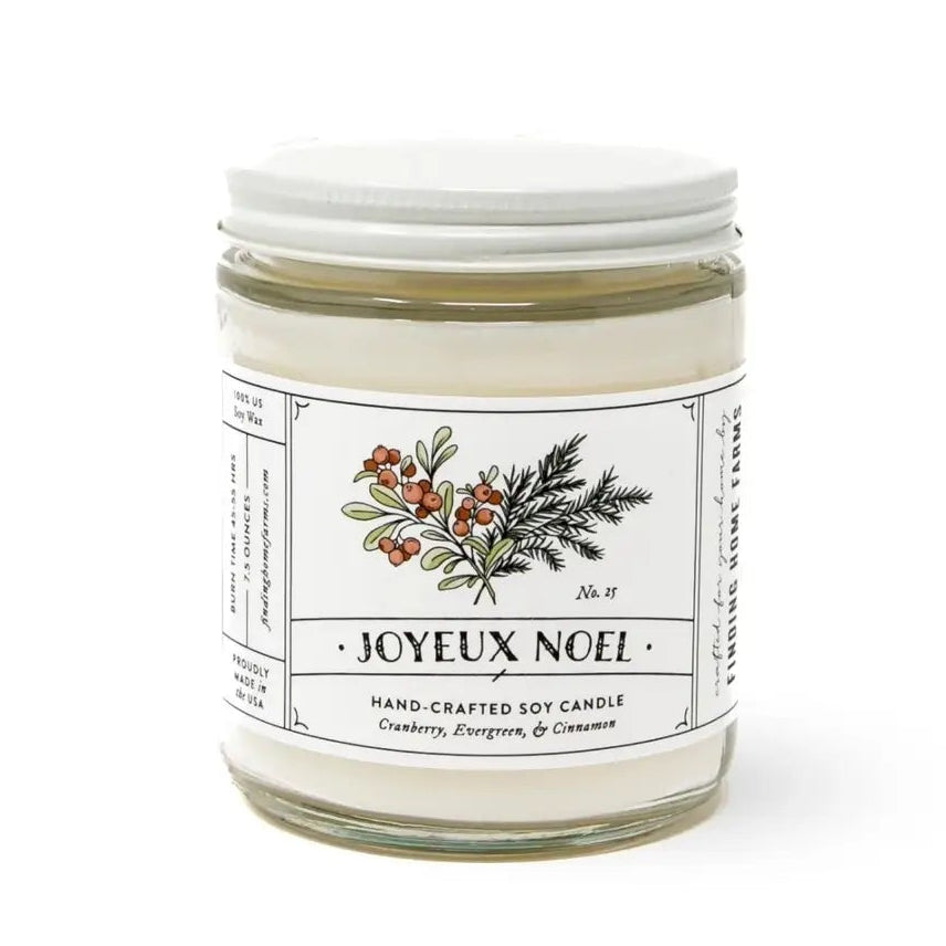 white holiday joyeaux candle with design 