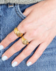 Hand with gold rings in pants pocket
