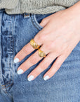 Hand with Gold Croissant ring and Cancer | Gold Plated Engraved Zodiac Ring in denim pocket