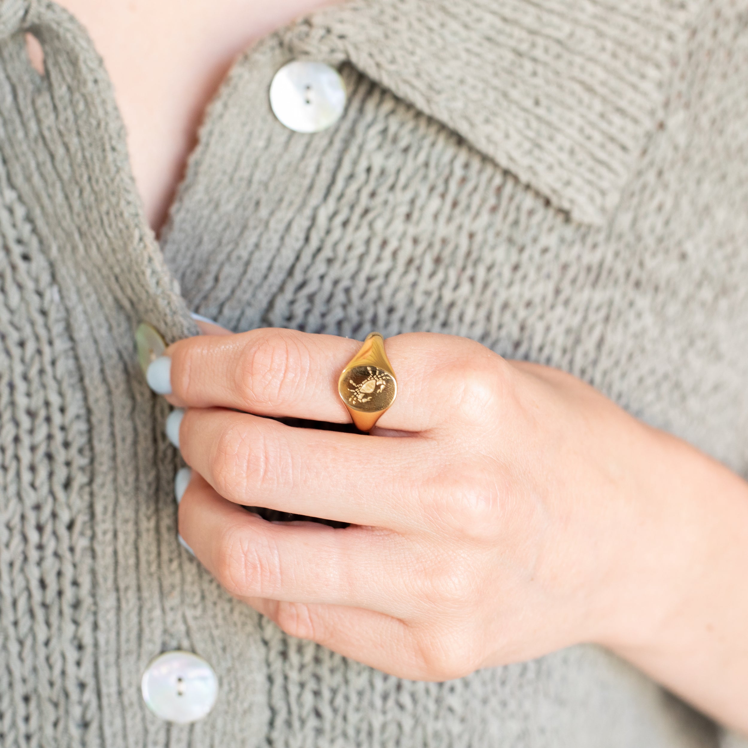 Girl wearing Cancer | Gold Plated Engraved Zodiac Ring on index finger