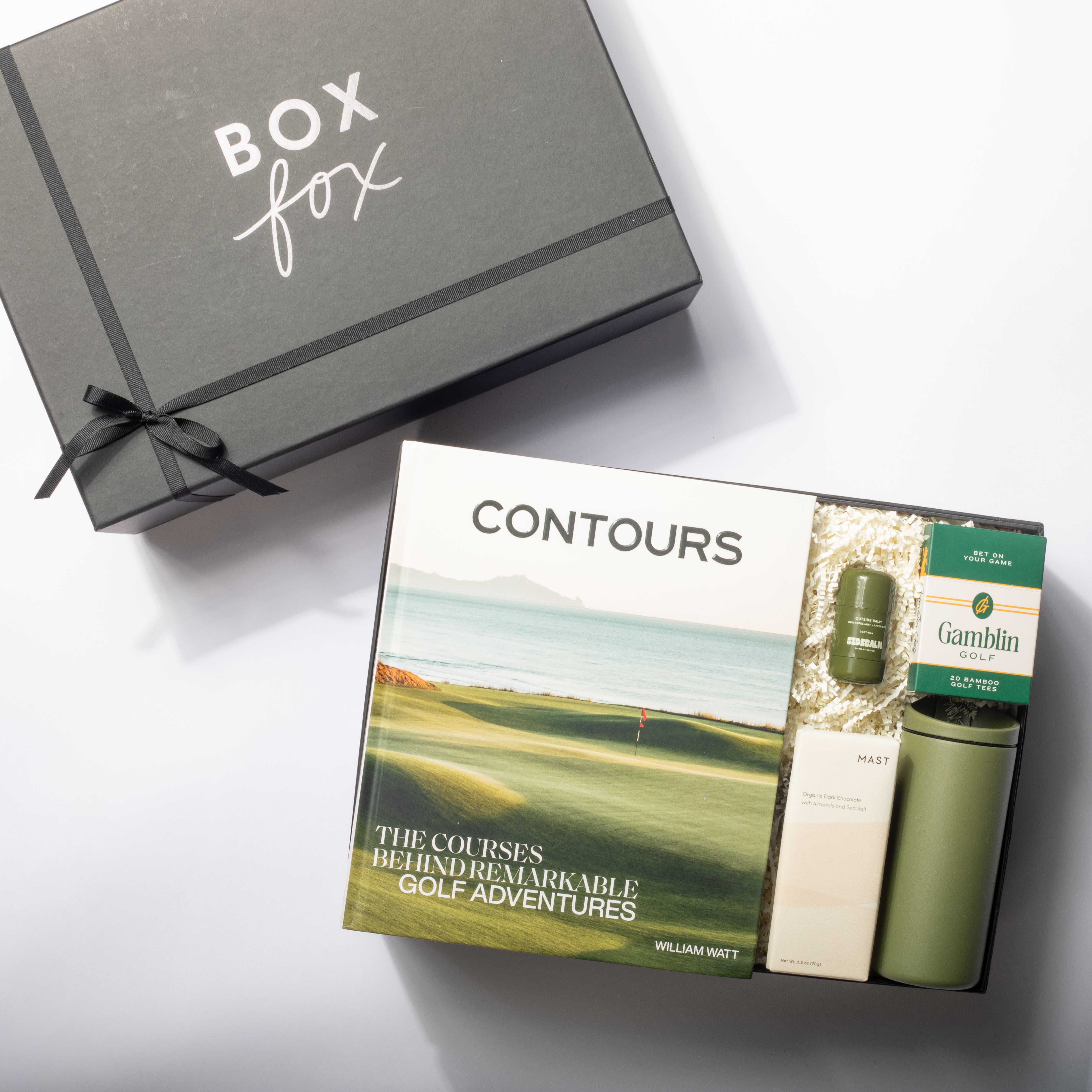 Box Fox gift set with 'Contours' book and green thermos on a white surface