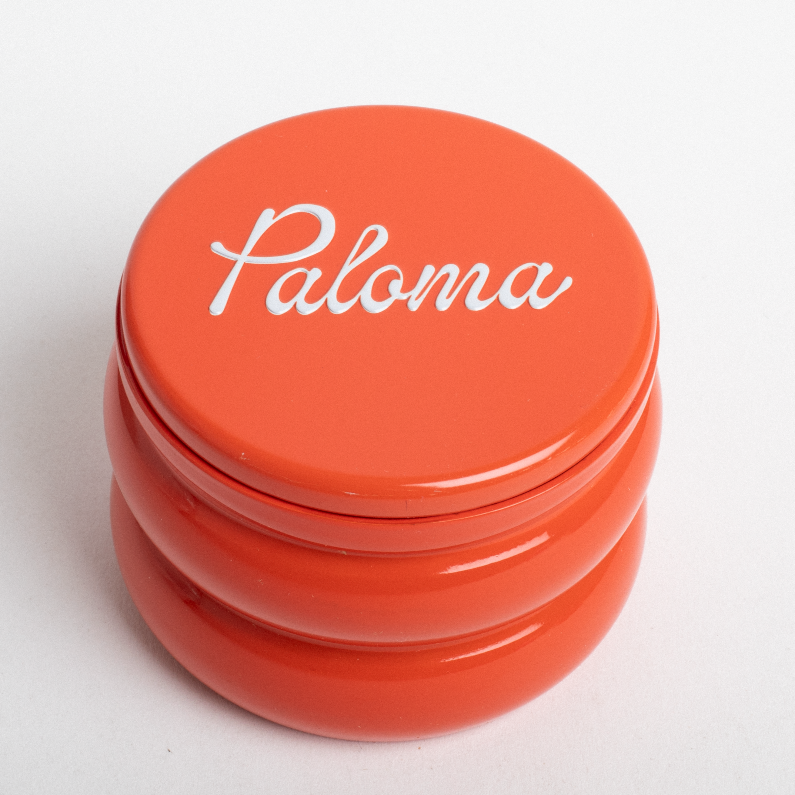 Orange container with 'Paloma' branding on a white background