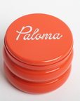 Orange container with 'Paloma' branding on a white background