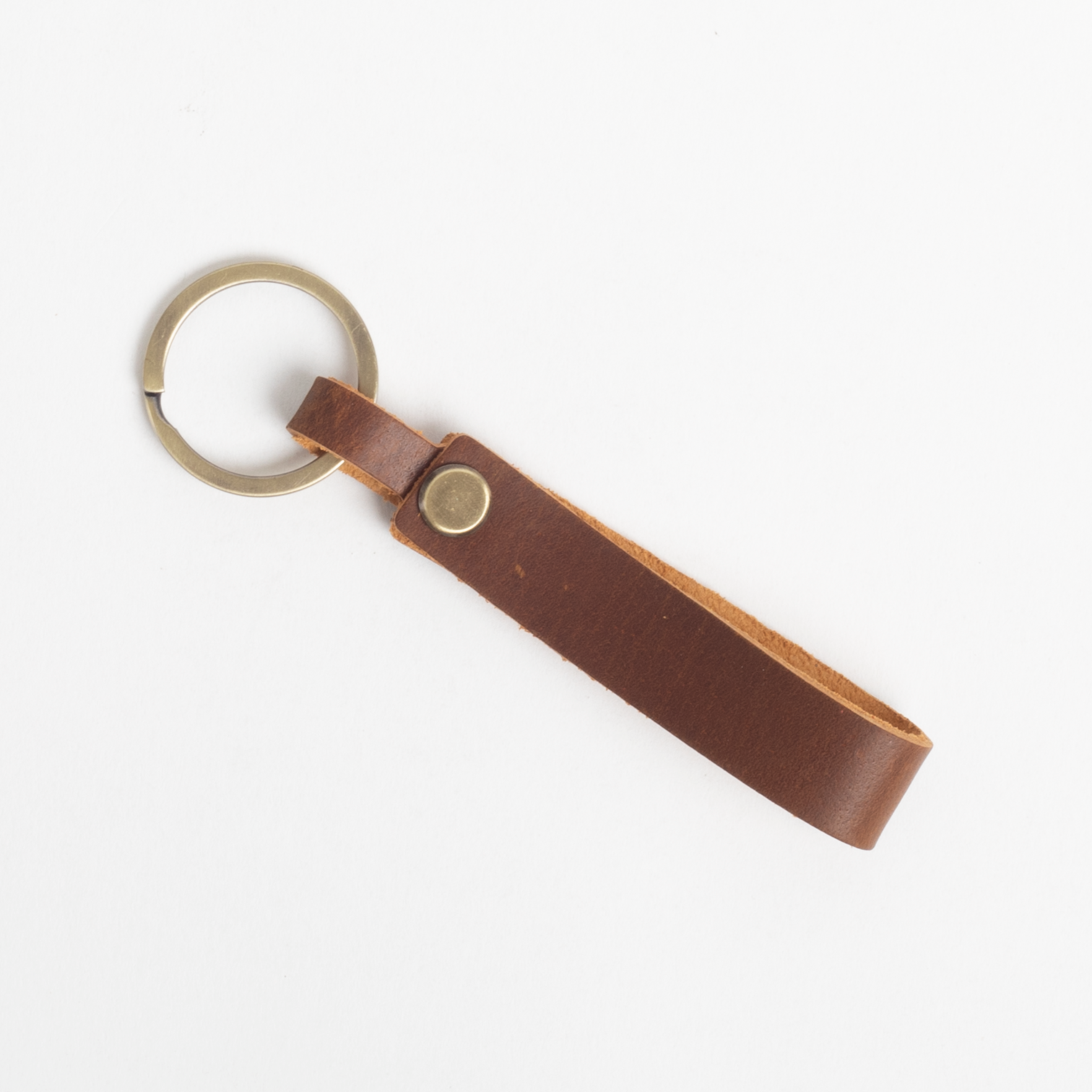 Brown leather keychain on a white background