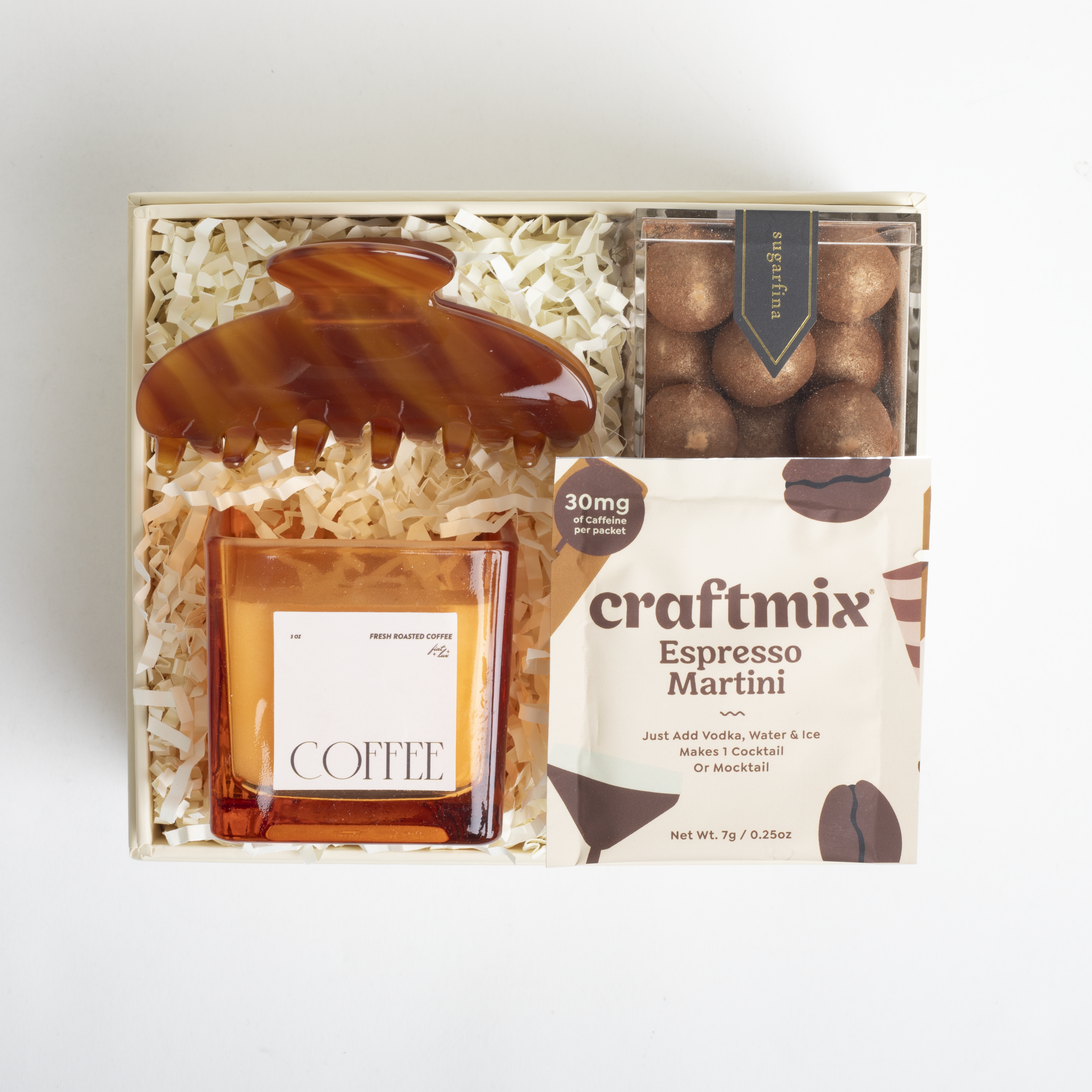 Gift set with a coffee-themed candle, decorative item, and craftmix espresso martini mix.
