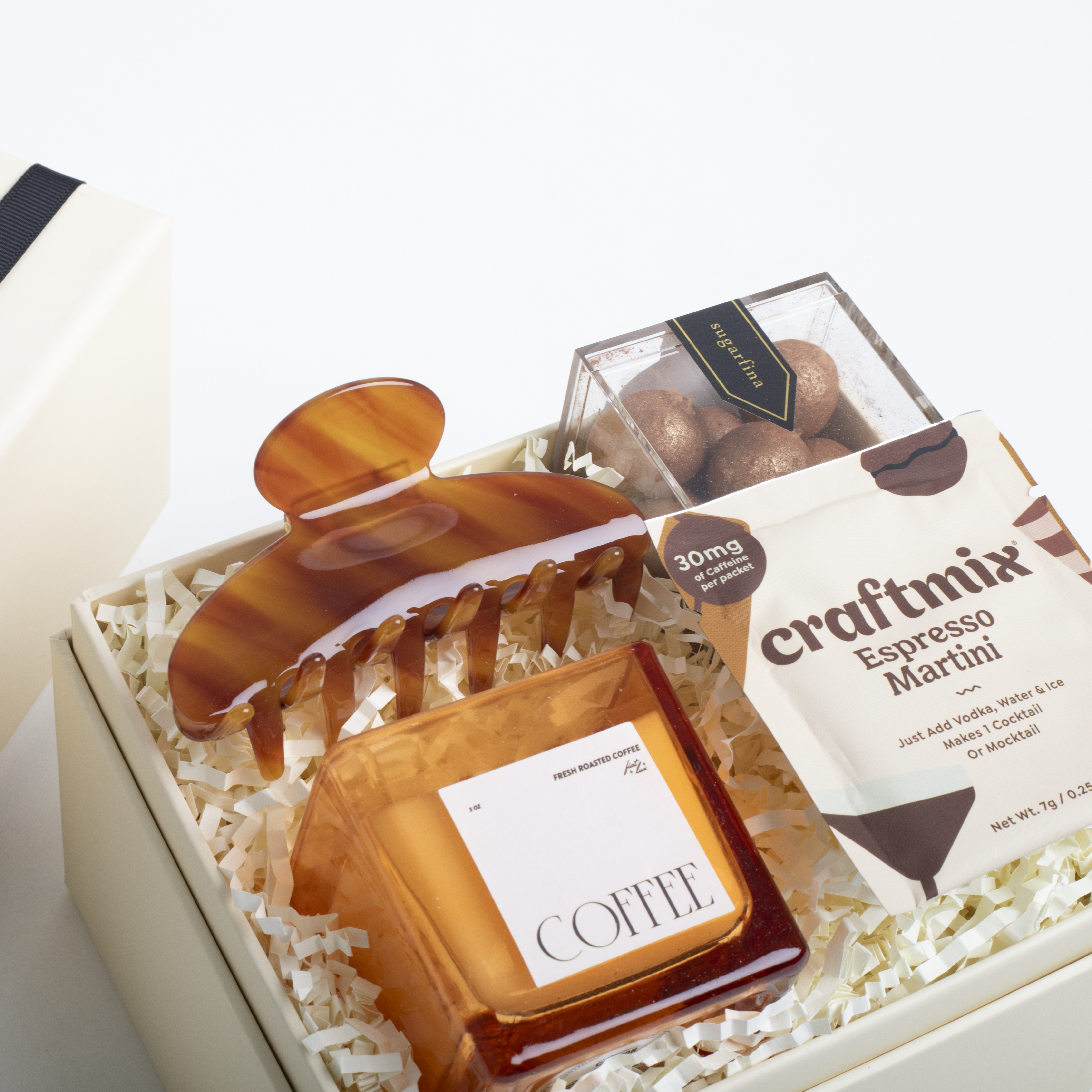 Gift set with coffee-themed items including a wooden coffee scoop, a small box labeled 'COFFEE', and a package of 'craftmix Espresso Martini'.