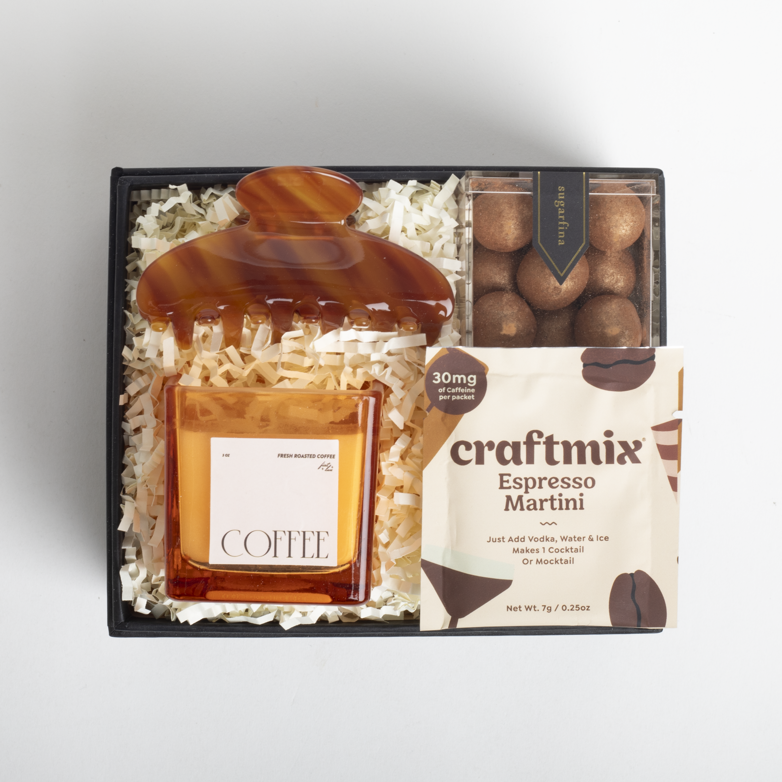Gift set with coffee-themed items including a bottle labeled &#39;Coffee&#39; and a box of &#39;craftmix Espresso Martini&#39;.