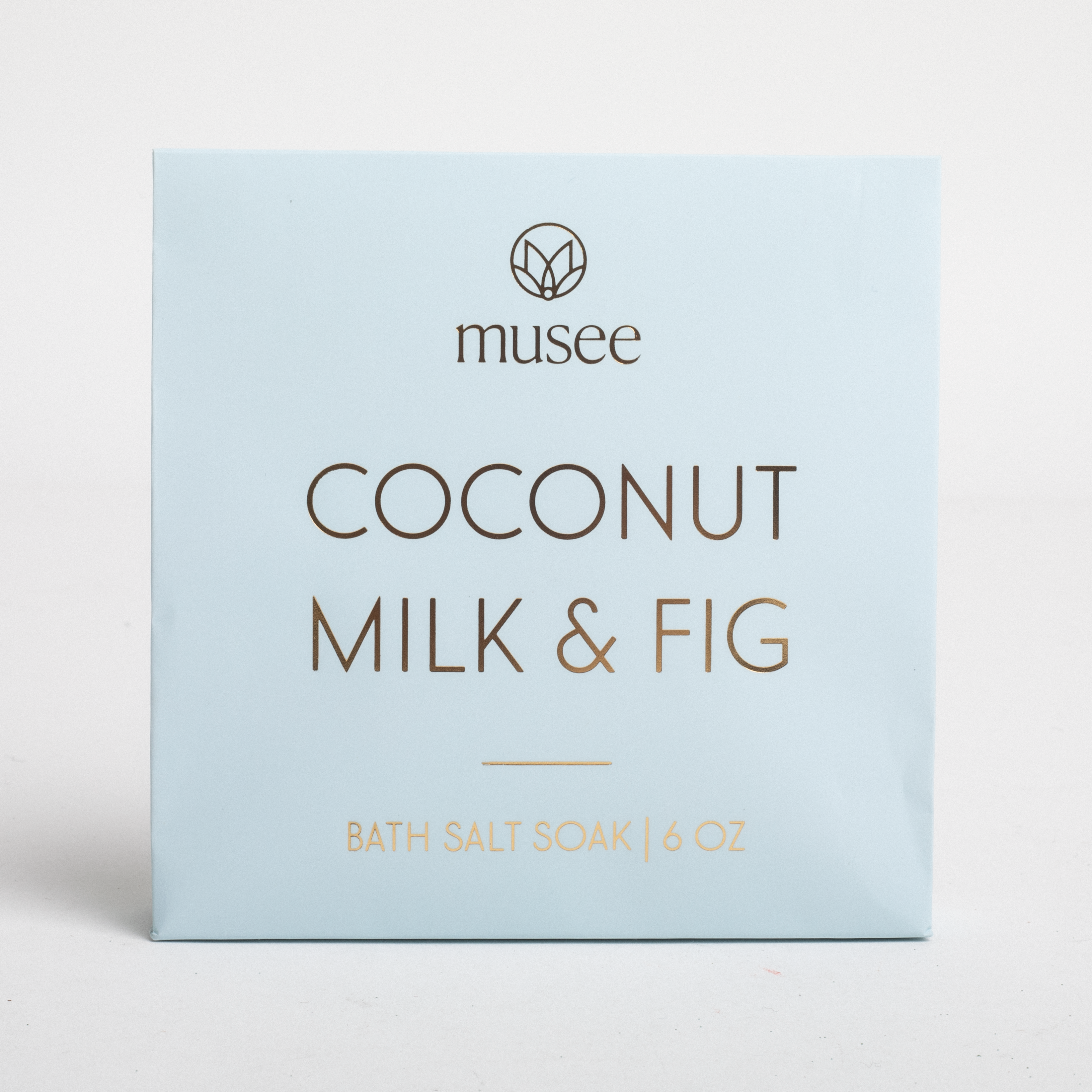 Box of musee Coconut Milk & Fig bath salt soap on a light gray background