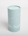 Light blue cylindrical container with text on a white background