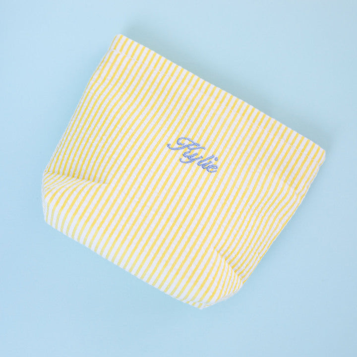 Yellow striped underwear with 'Flyte' branding on a light blue background