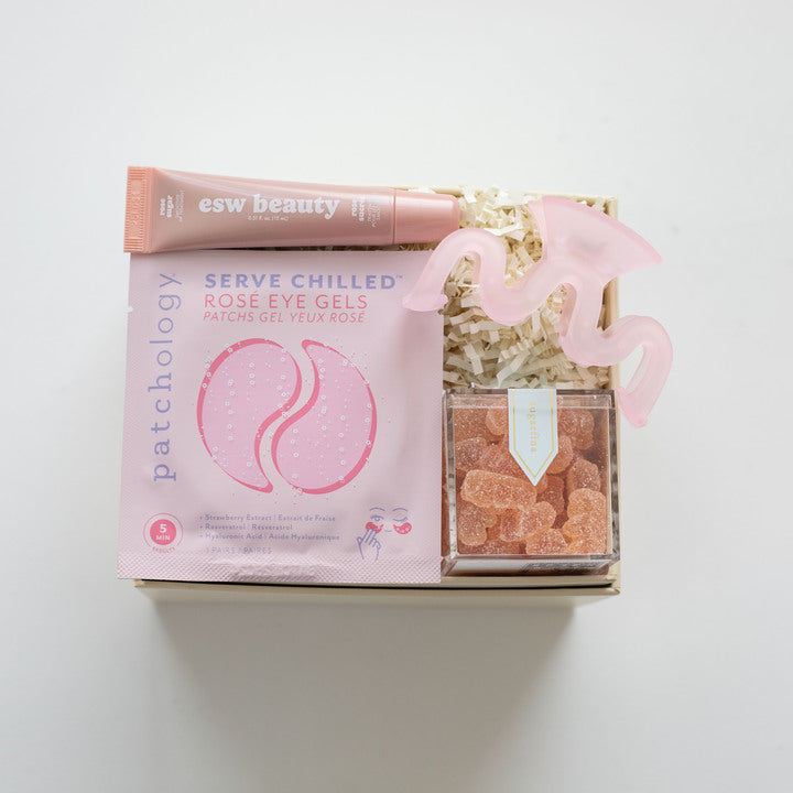 Packaged rose eye gels with a pink box on a white background