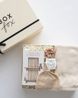 Baby hat, blanket, and book set with 'Box Fox' packaging on a white background