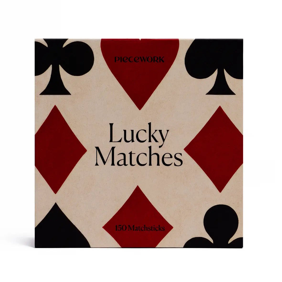 Matches packaging with playing card symbols on a beige background