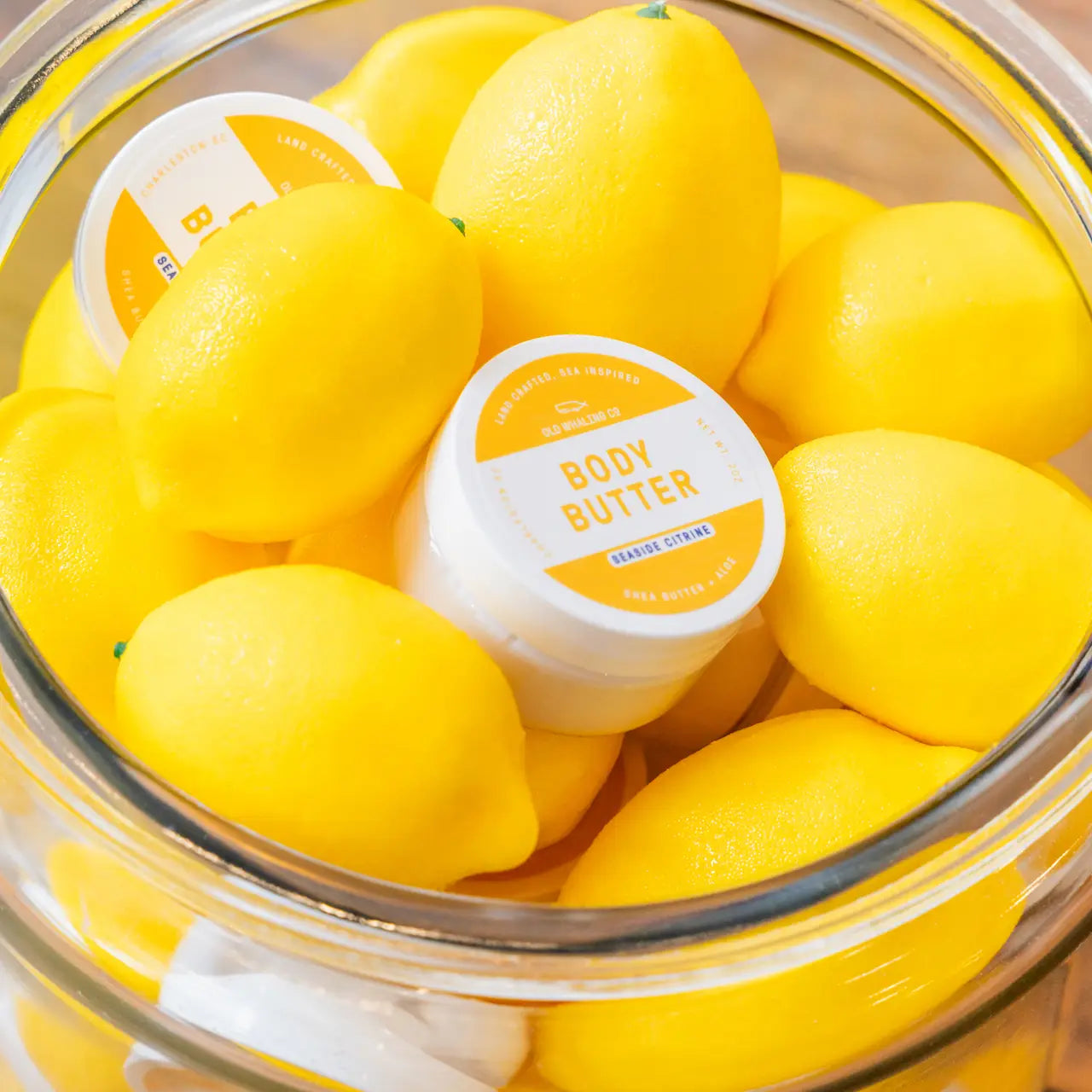 Body butter in a bowl of lemons