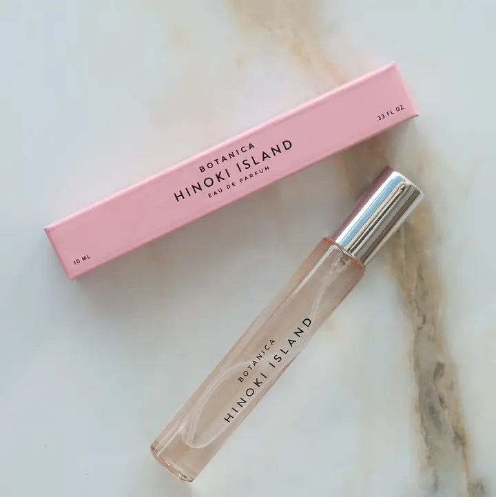 hinoki island pefume on a marble background