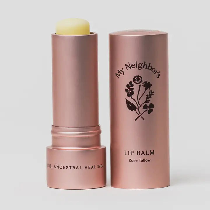 Lip balm with rose gold packaging on a white background