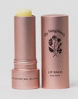 Lip balm with rose gold packaging on a white background