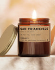 Candle with a label on a soft, neutral background