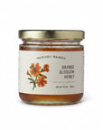 Jar of Mcevoy Ranch Orange Blossom Honey on a white background