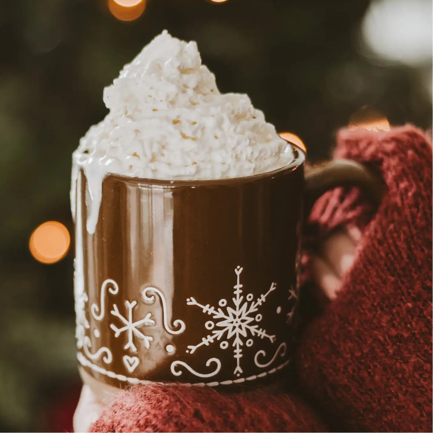 brown mug with white snowflakes