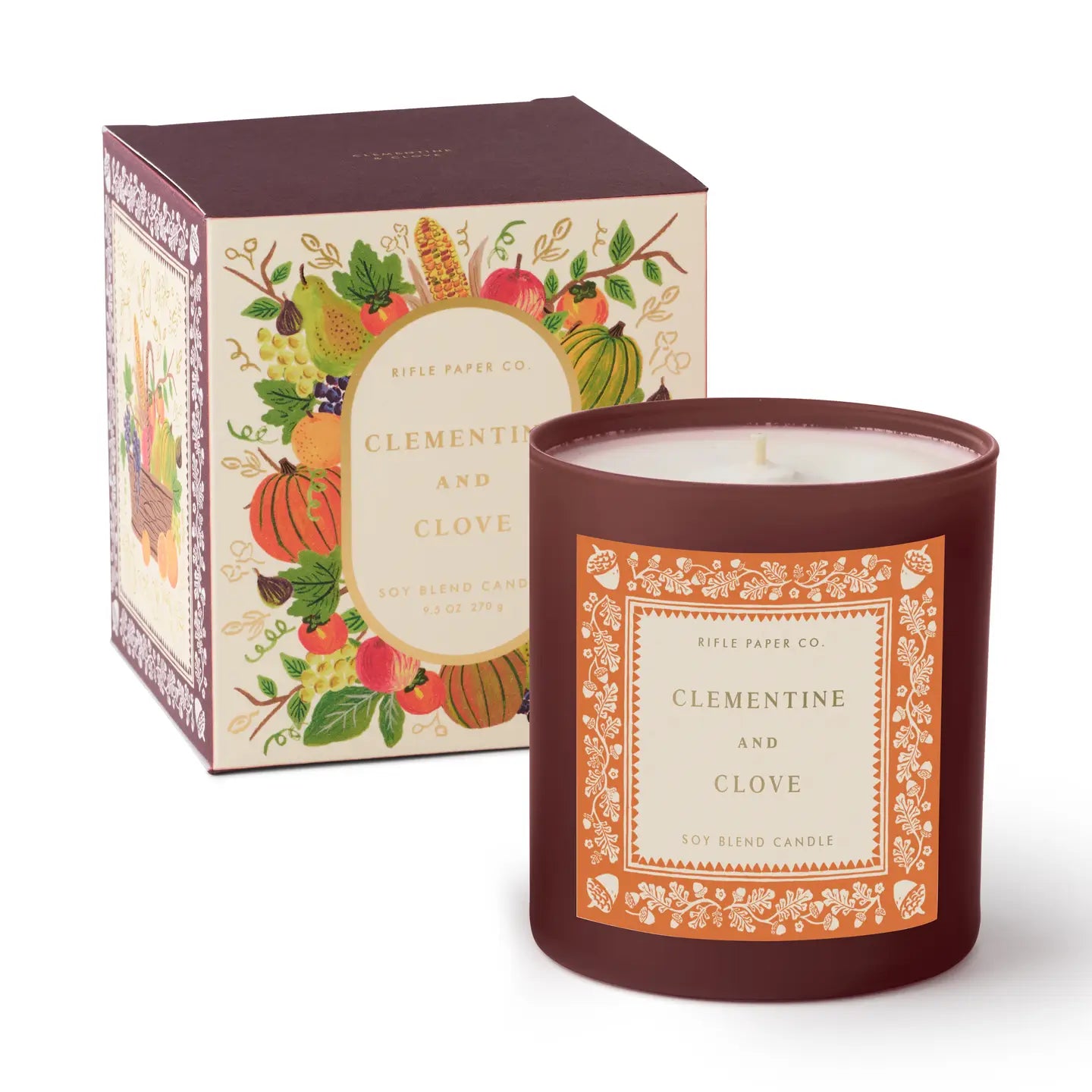 Candle with decorative label and matching box on a white background