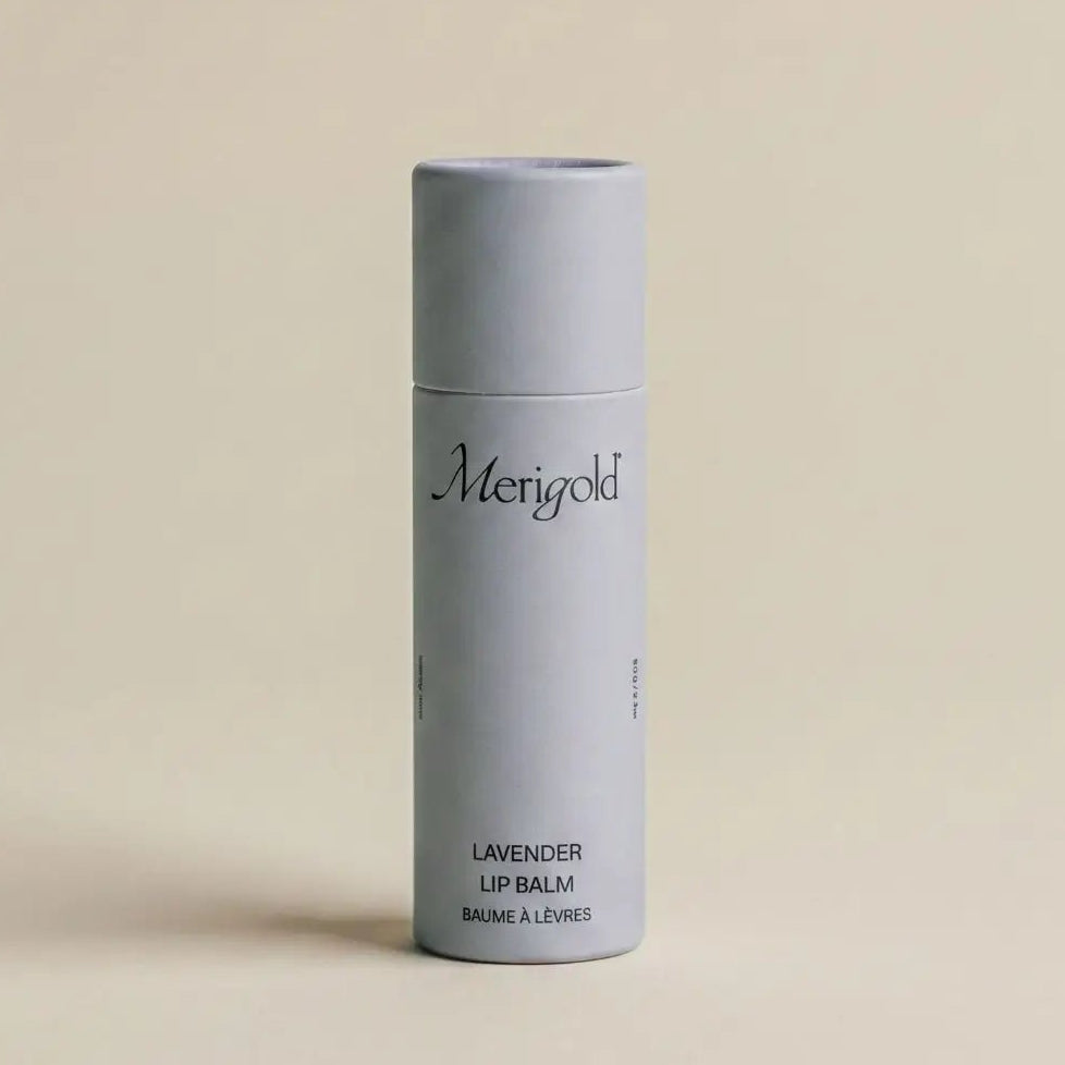 lavender merigold lip balm on a beige background