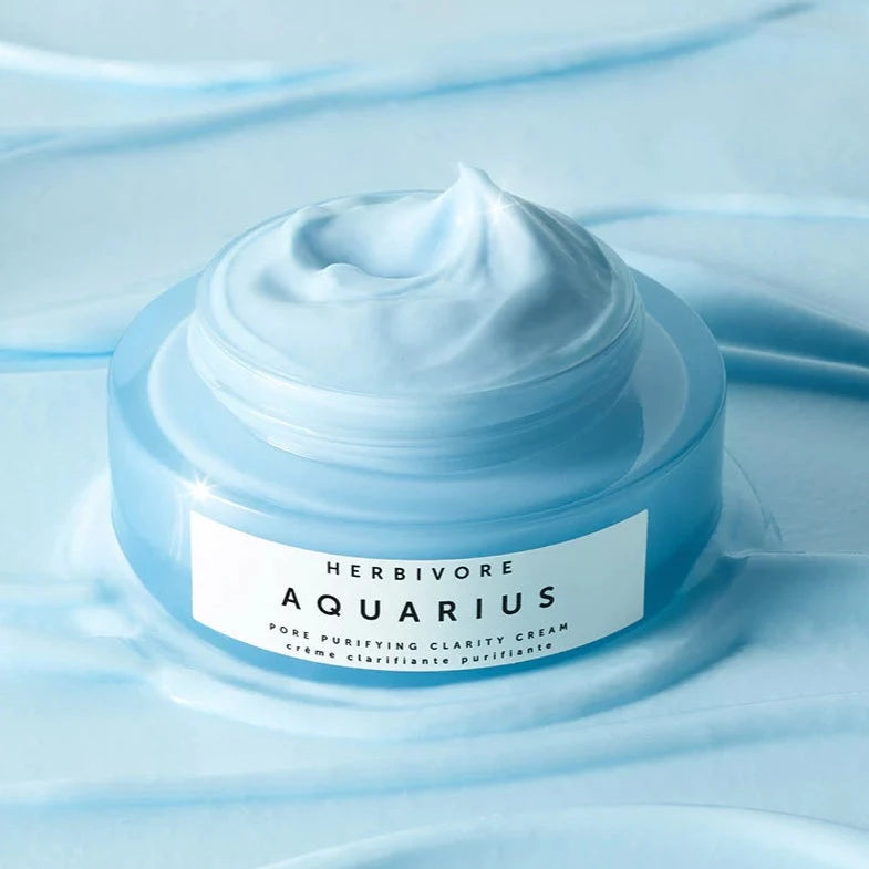 Aquarius Pore Purifying Clarity Cream sitting on top of a background of the cream