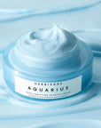 Aquarius Pore Purifying Clarity Cream sitting on top of a background of the cream