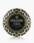 Voluspa Ambre Lumiere candle packaging on a white background