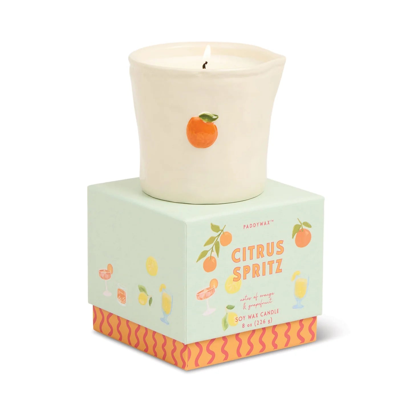 Candle with 'Citrus Spritz' packaging on a white background