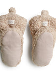 back of light brown fuzzy booties. show cloth of the sole part of the booties