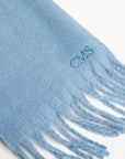 Blue scarf with fringes and 'CMS' embroidery on a white background